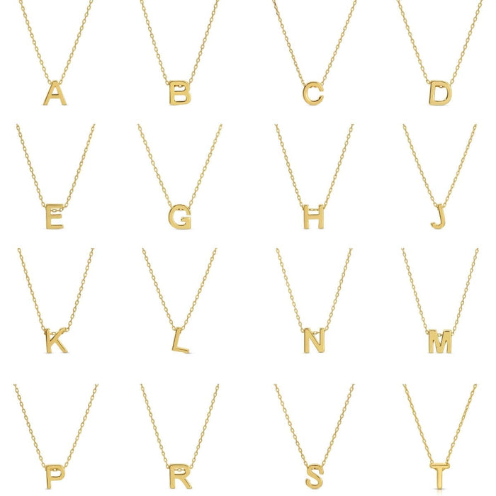 Gold necklaces with letters A to T on a white background