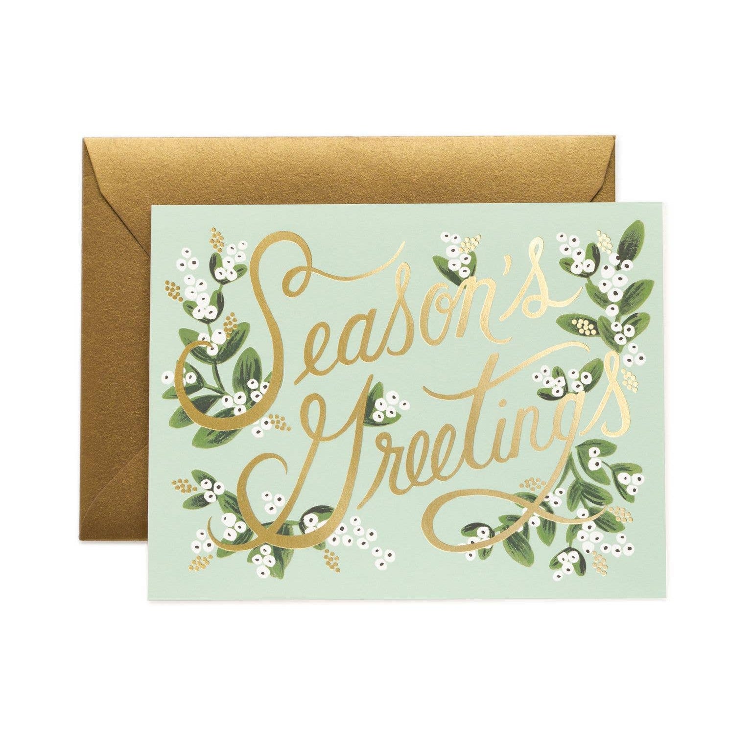 Greeting card with 'Season's Greetings' text and gold foil design on a light green background, accompanied by a brown envelope.