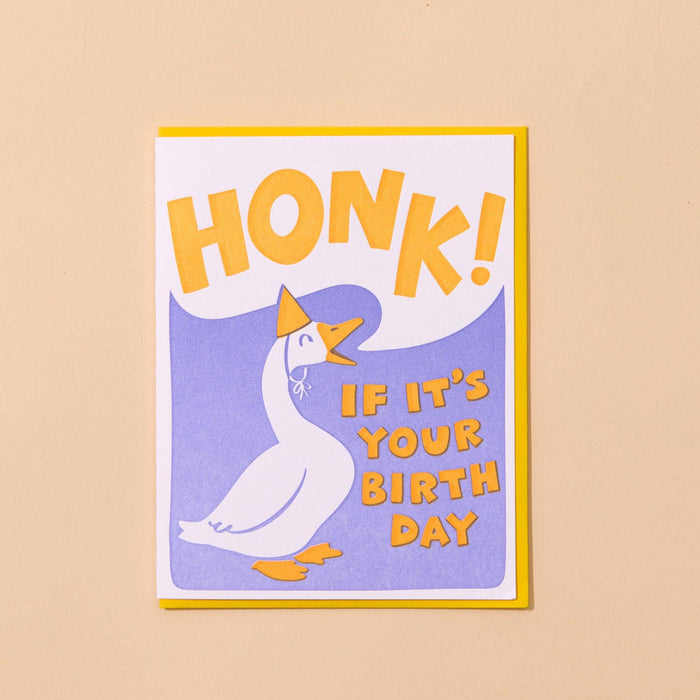 Framed card with a goose and text 'Honk! If it's your birthday' on a beige background