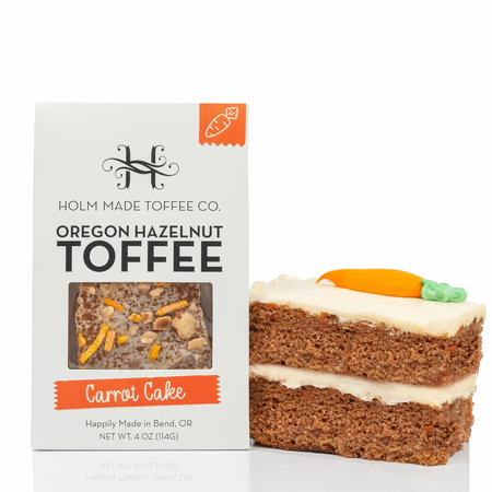 Holm Made Toffee Co. Oregon Hazelnut Toffee Carrot Cake with toffee piece on a white background
