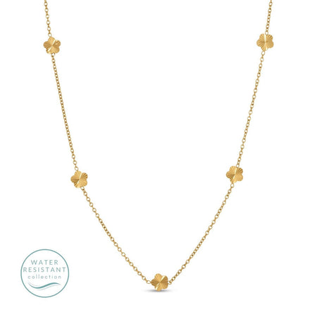 Gold necklace with floral pendants on a white background