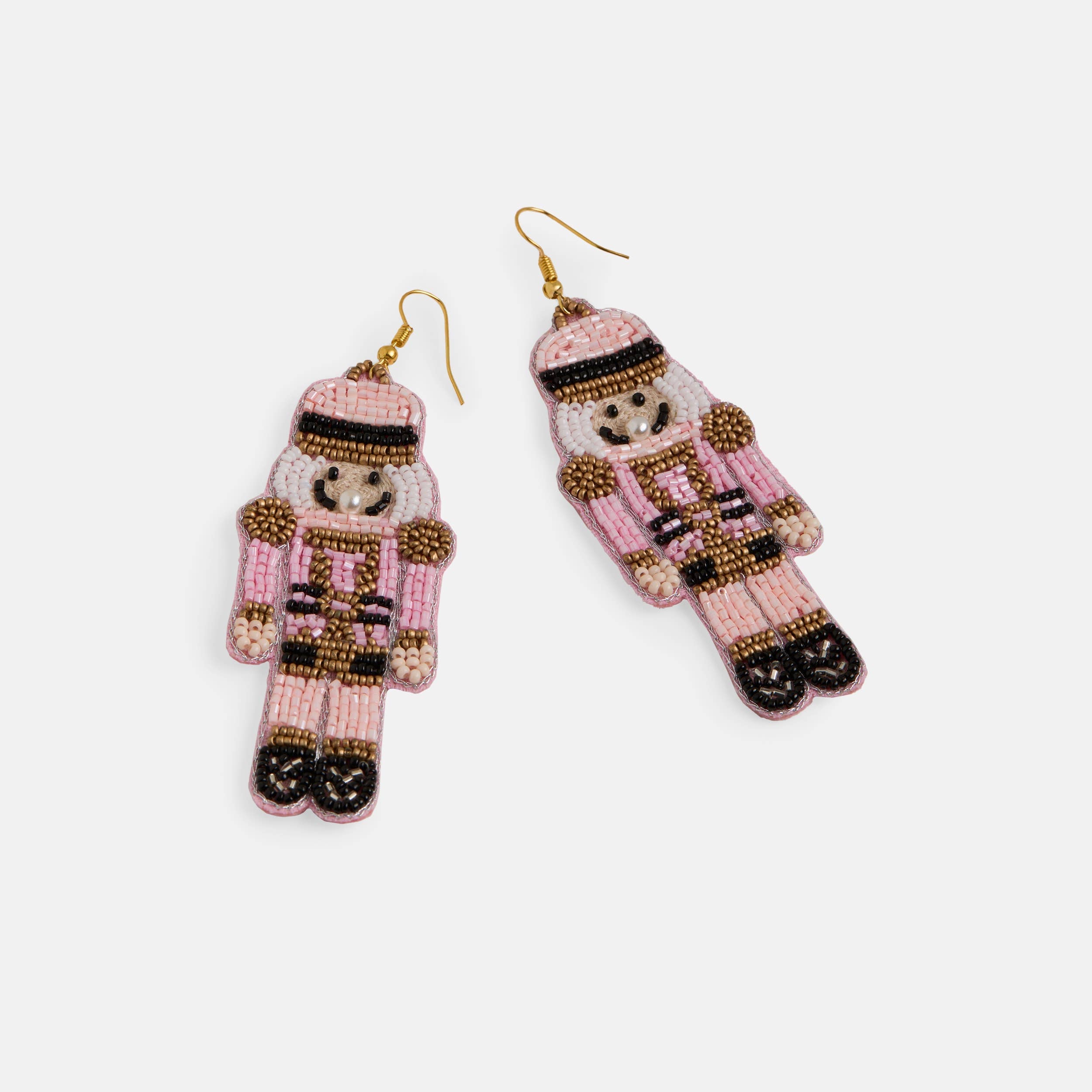 Beaded nutcracker earrings on a white background