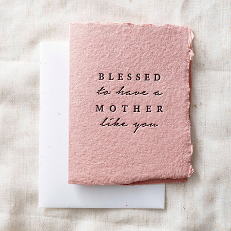 Flat Pink card with 'Blessed to have a mother like you' text on a textured surface