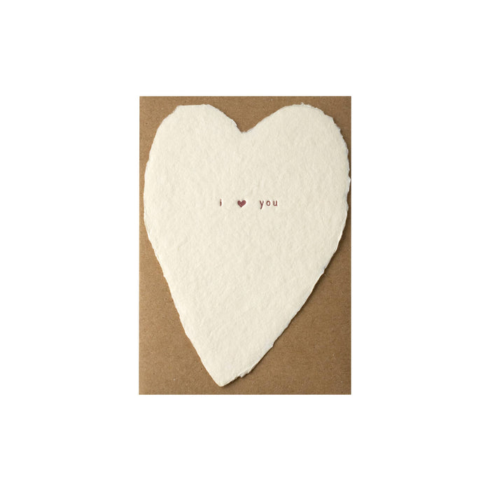 Heart-shaped plush toy with 'I love you' text on a brown background