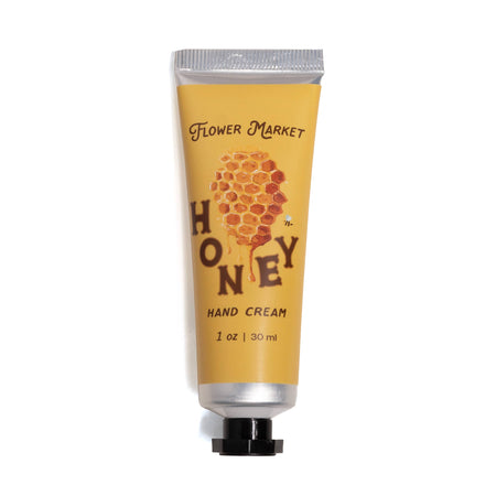 Hand cream tube labeled 'Honey' from 'Flower Market' on a white background