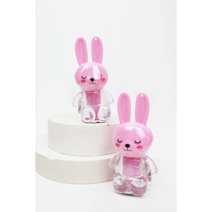 Two pink rabbit-shaped lipgloss bottles with a white background