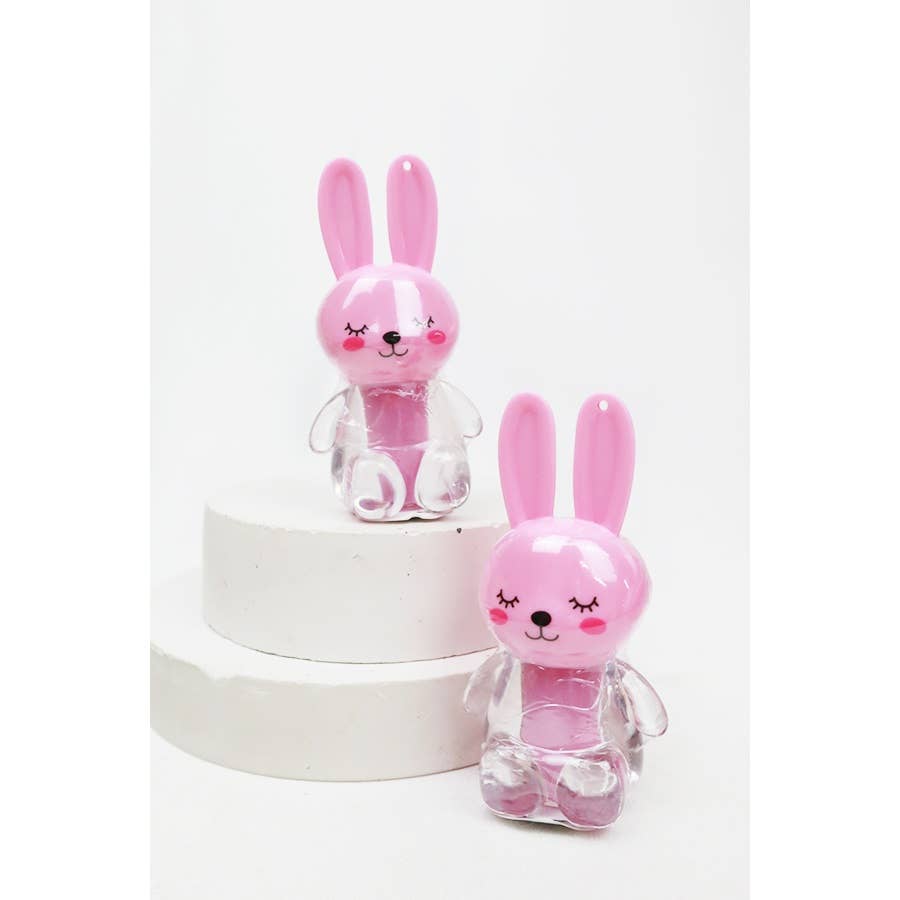 Two pink rabbit-shaped lipgloss bottles with a white background