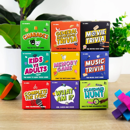 boxes of different card games on a desk
