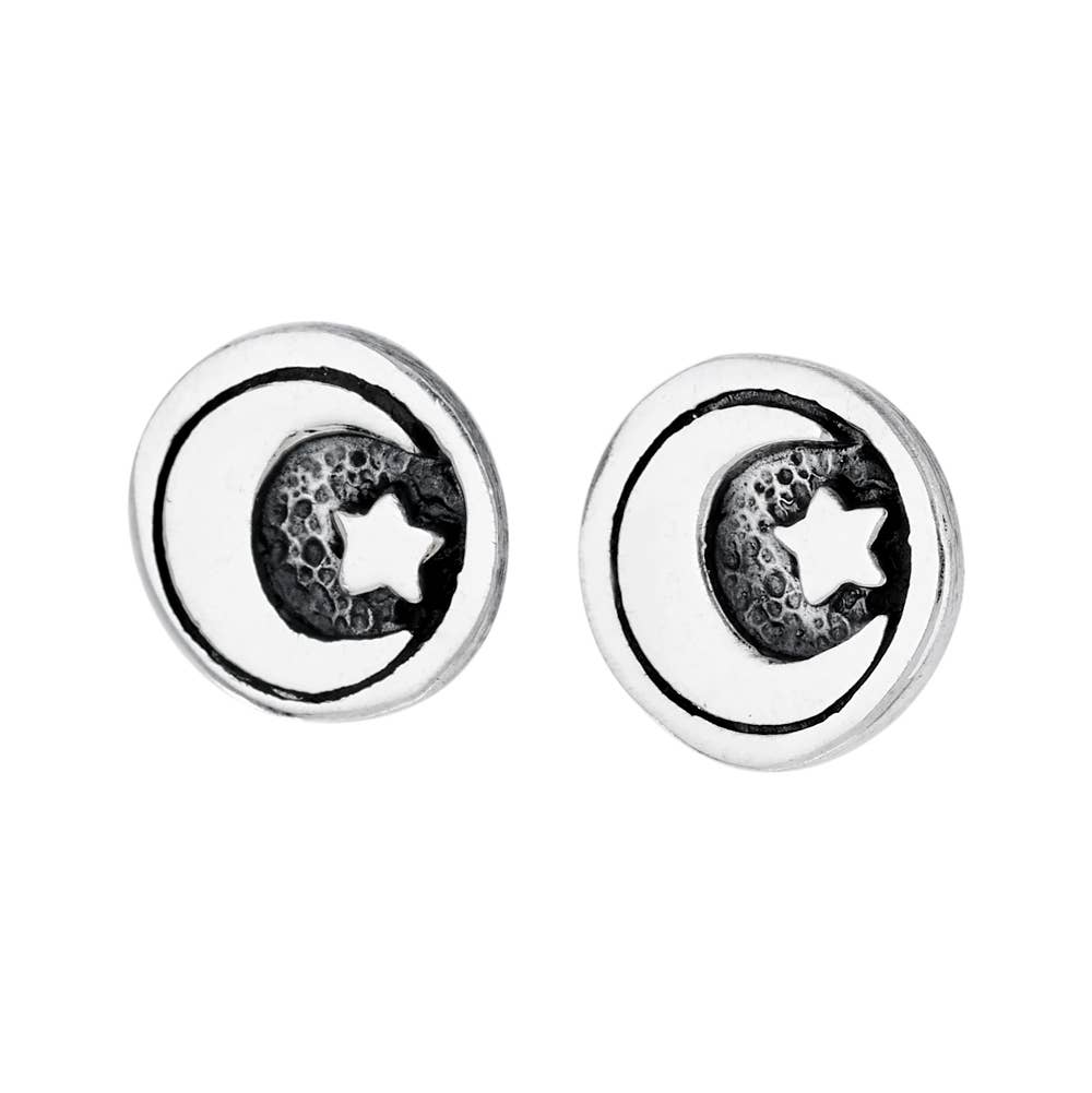 Pair of silver earrings with moon and star design on a white background