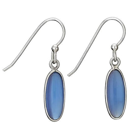 A pair of silver drop earrings featuring oval blue cabochon gemstones in silver bezel settings, suspended from silver fishhook wires on a plain white background.