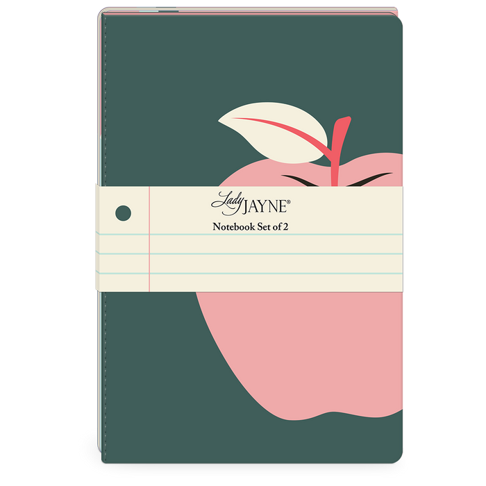 A dark teal notebook with a pink apple illustration and a cream-colored paper band reading 'Lady JAYNE Notebook Set of 2', shown on a plain white background.