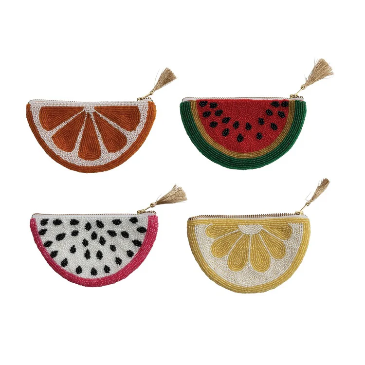 Four beaded pouches shaped like fruit slices on a white background