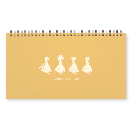 Yellow notebook with white duck illustrations and text on a white background