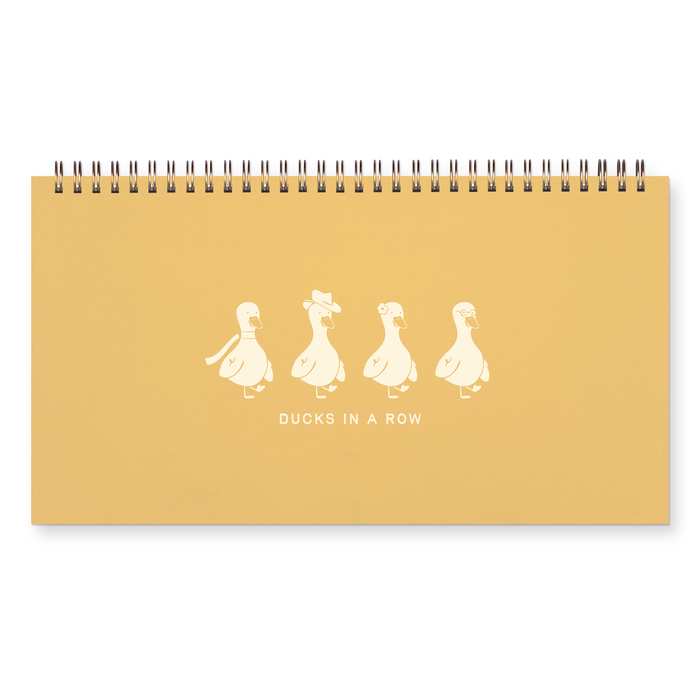 Yellow notebook with white duck illustrations and text on a white background