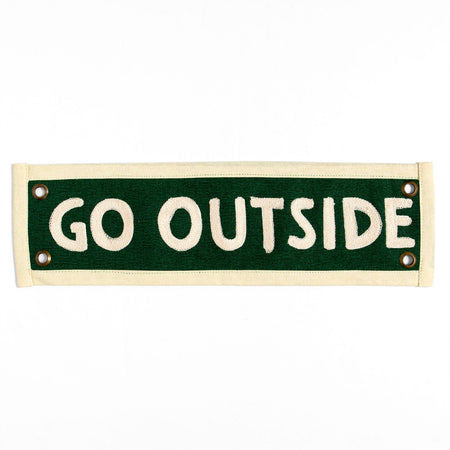 Green sign with 'GO OUTSIDE' text on a white background