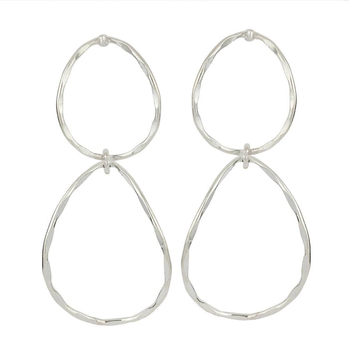 Pair of silver hoop earrings on a white background