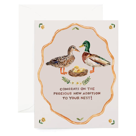 Greeting card with ducks and a nest, featuring text 'Congrats on the precious new addition to your nest'.