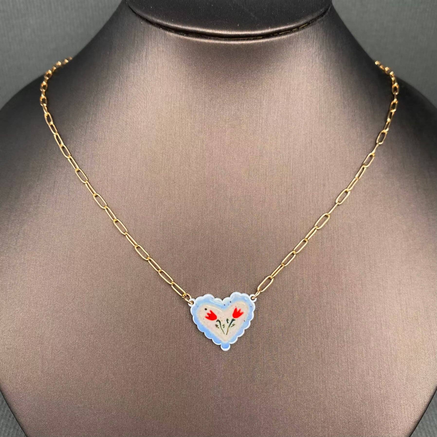 Necklace with a heart-shaped pendant on a mannequin