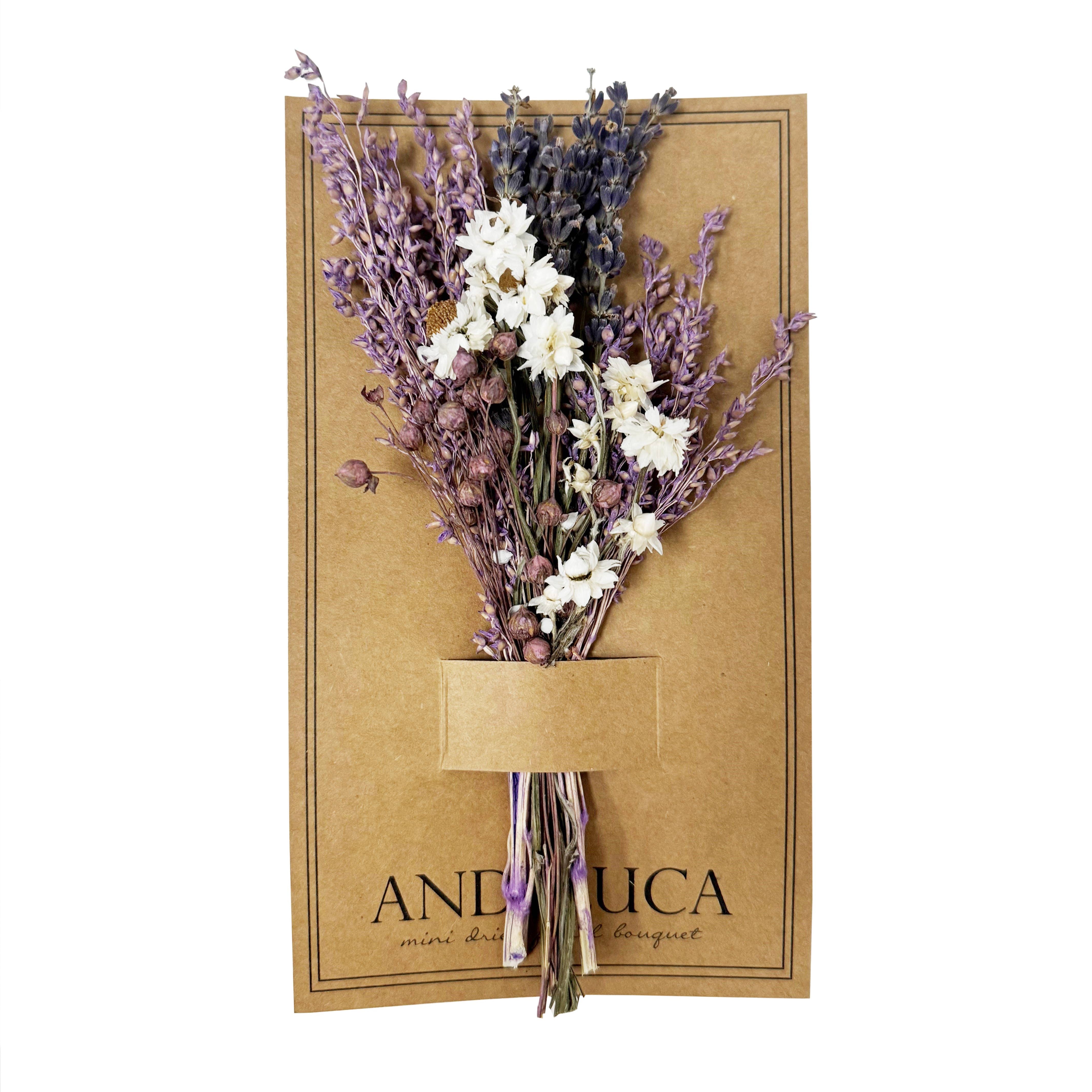 Bouquet of dried lavender and white flowers on a brown paper card