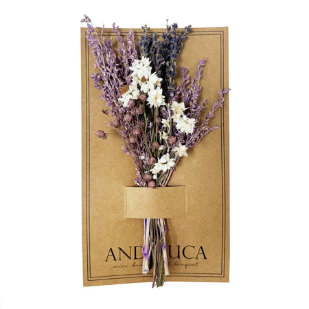 Bouquet of dried lavender and white flowers on a brown paper card