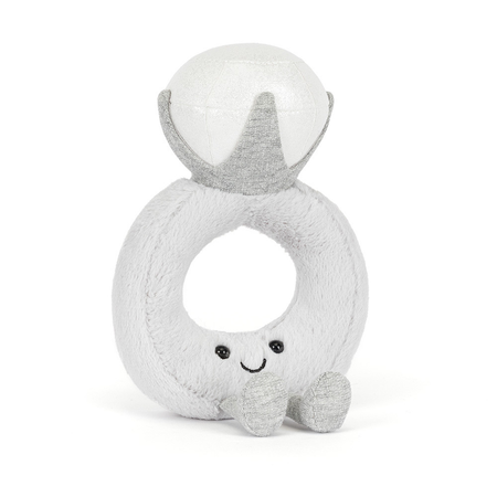 plush jellycat toy shaped like an engagement ring with a smiley face and legs on a white background
