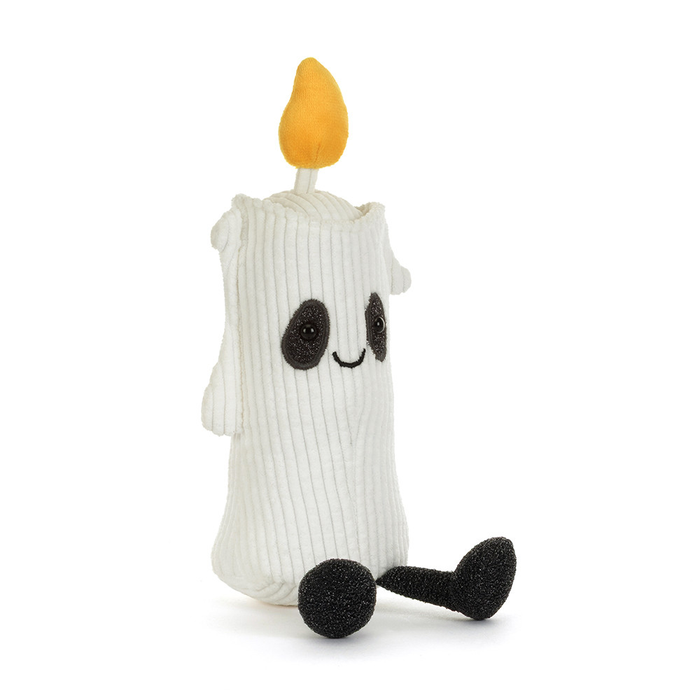 A white corduroy ghost candle plush toy with a yellow-orange flame on top, black embroidered eyes and mouth, and black feet, shown on a plain white background.