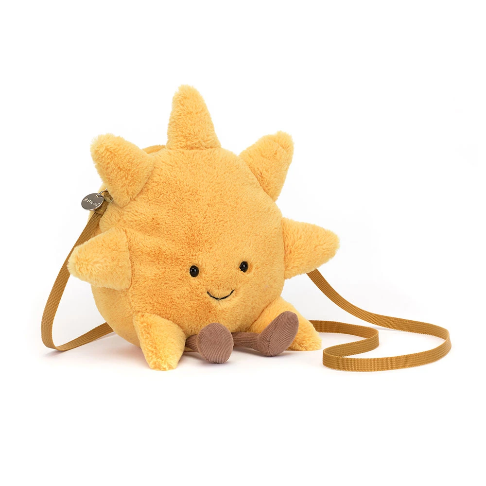 yellow sun bag with a brown strap and a face + legs