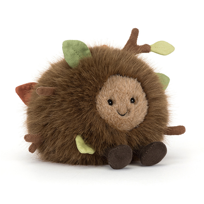 round brown stuffie with face and leaves coming out of fur