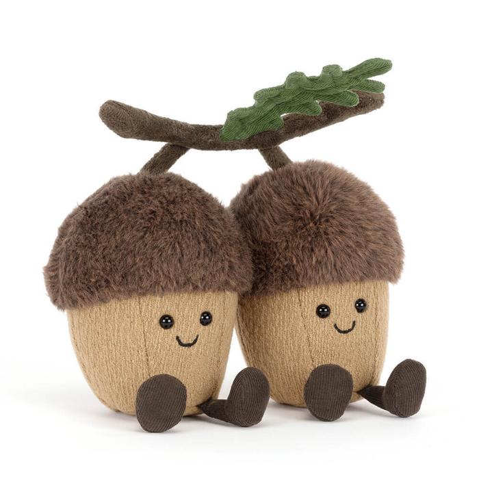 double acorn stuffie with smiley faces on both acorns. Connected by branch