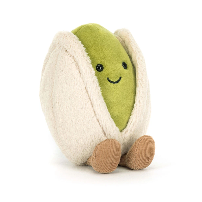 small pistachio stuffie toy with green and white features