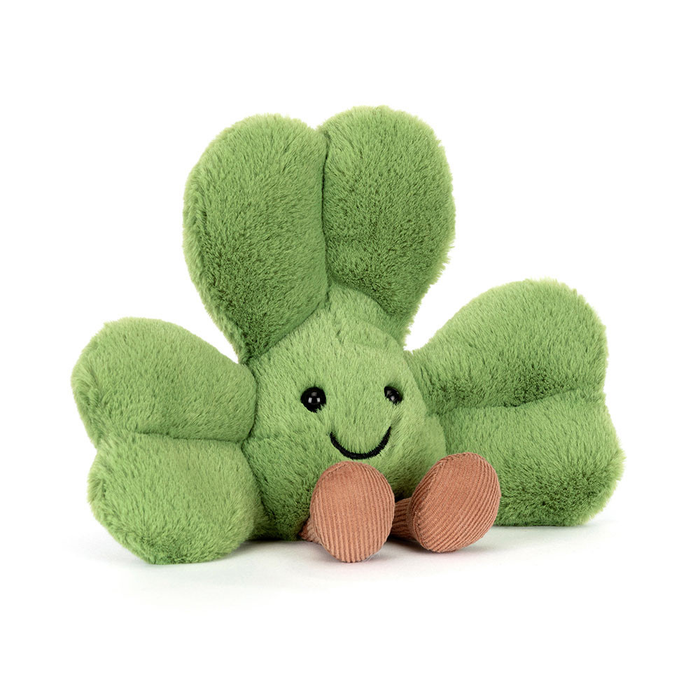 Green plush toy with a happy face on a white background