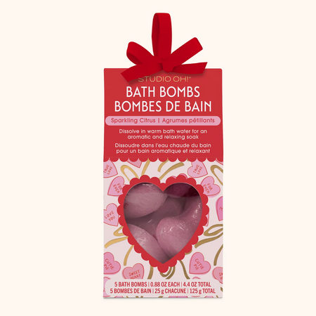 Packaging of bath bombs with a heart-shaped pink bath bomb on a white background