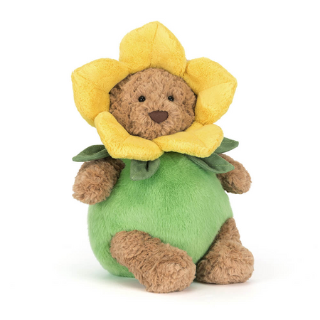 Plush toy bear with a yellow flower on a white background