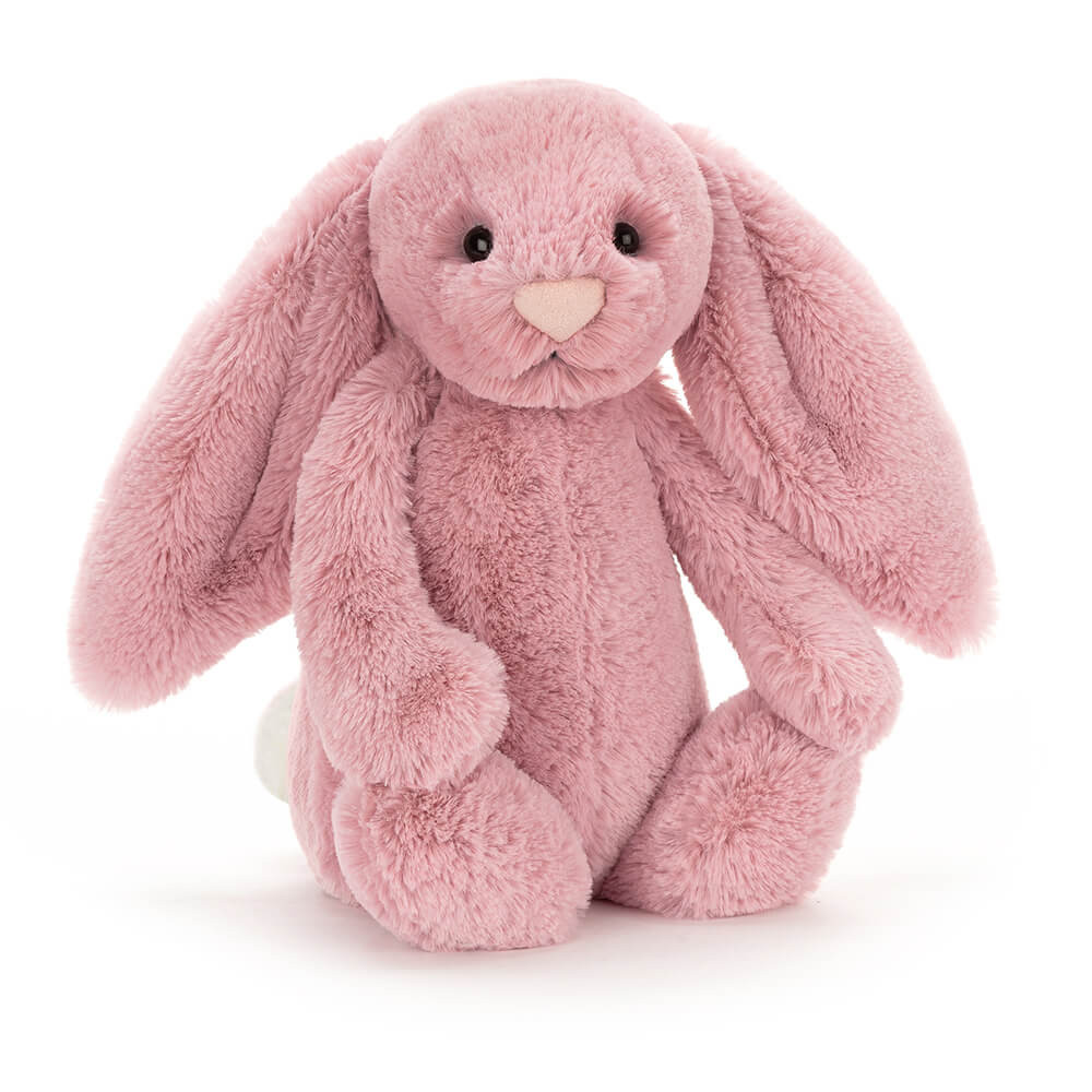 Tulip pink plush bunny sitting upright with long floppy ears, dark eyes, and a pale pink nose
