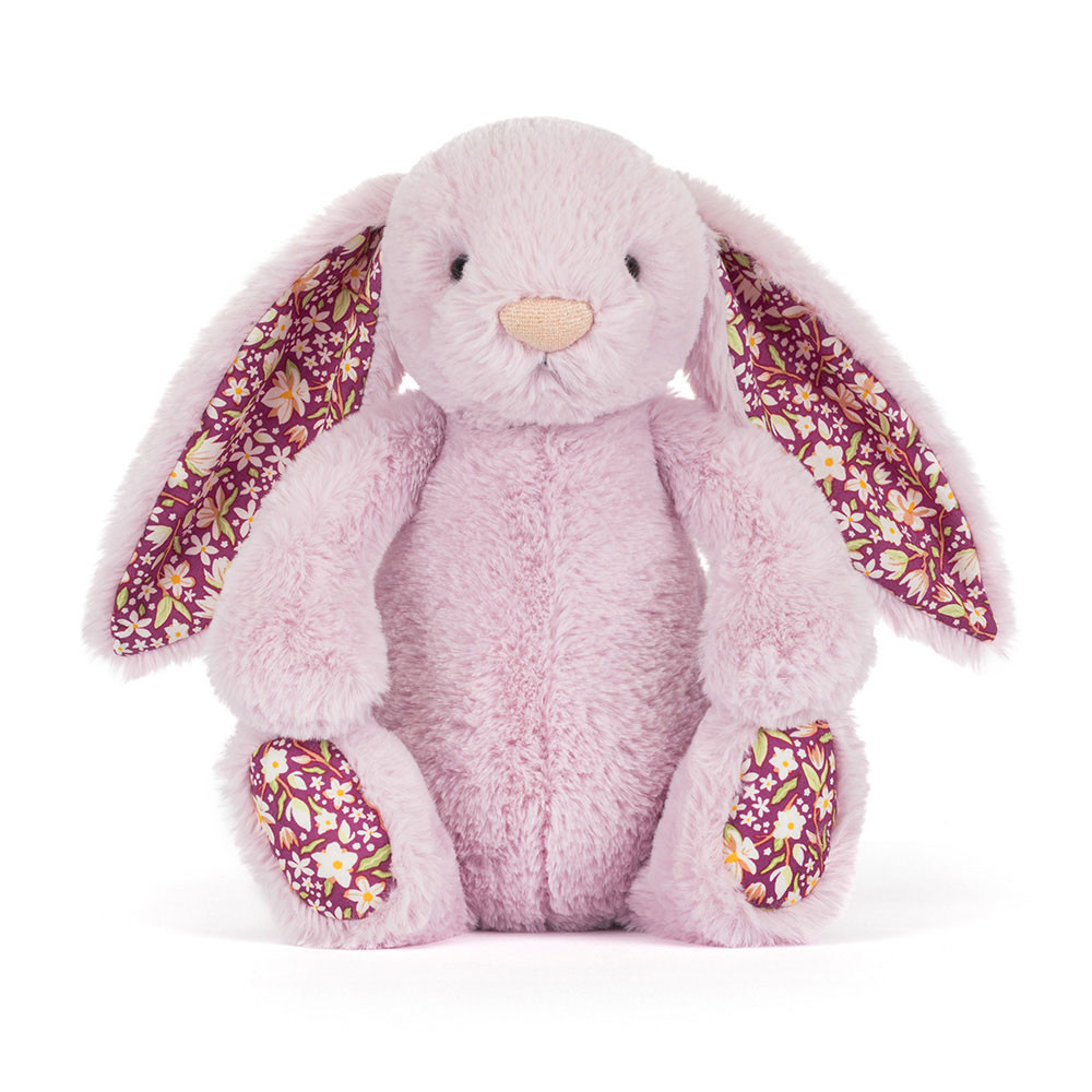 Pink plush bunny with floral ears and feet on a white background