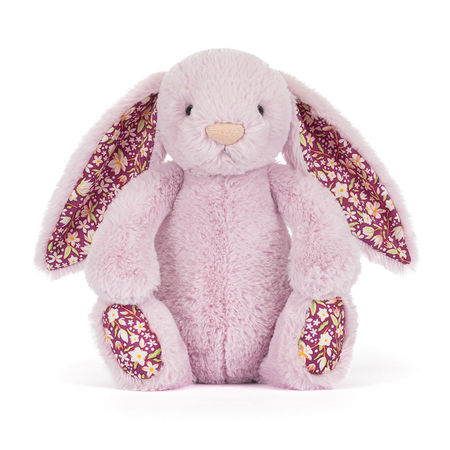 Pink plush bunny with floral ears and feet on a white background