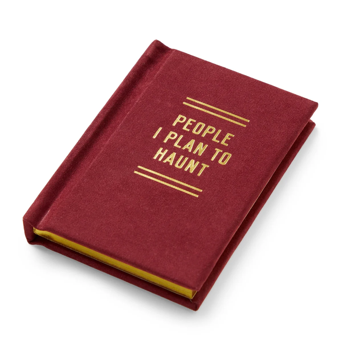 Maroon notebook with gold text on a white background