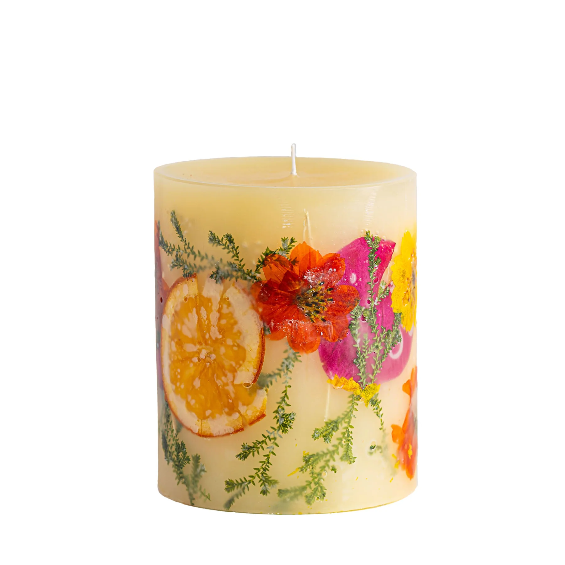 Decorative candle with floral and fruit design on a white background