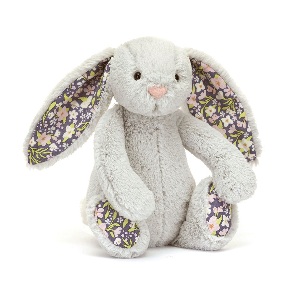 Plush bunny toy with floral ears on a white background