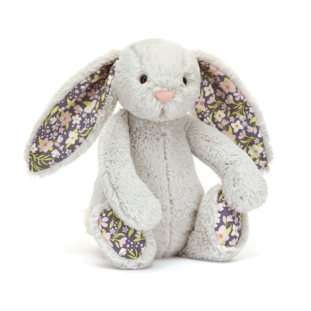 Plush bunny toy with floral ears on a white background