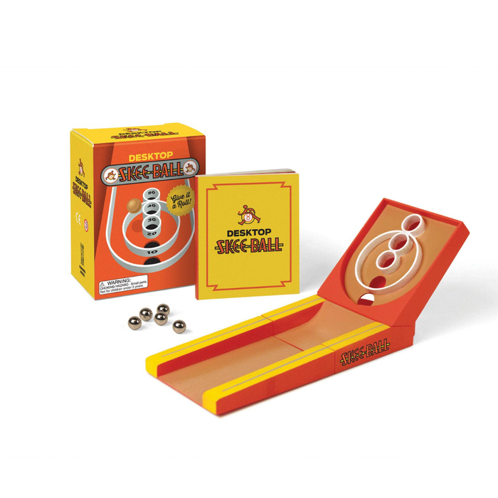 Desktop skee-ball game set with packaging on a white background