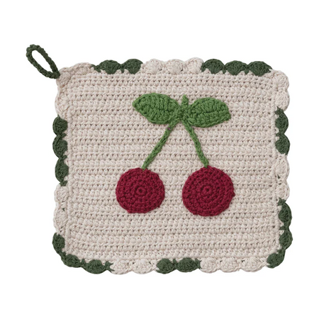 Crocheted pot holder with cherry design on a white background
