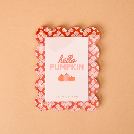 orange scalloped magnetic frame with place holder image that says "hello pumpkin" 