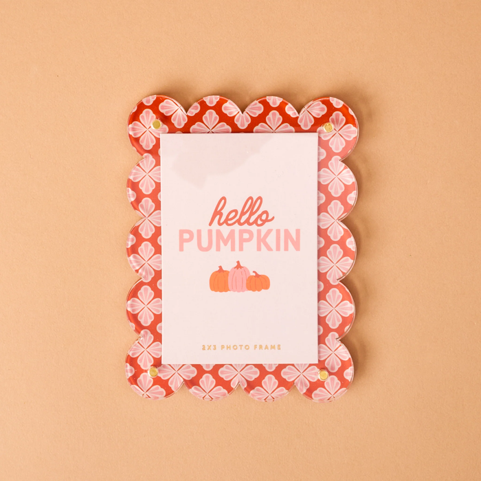 orange scalloped magnetic frame with place holder image that says "hello pumpkin" 