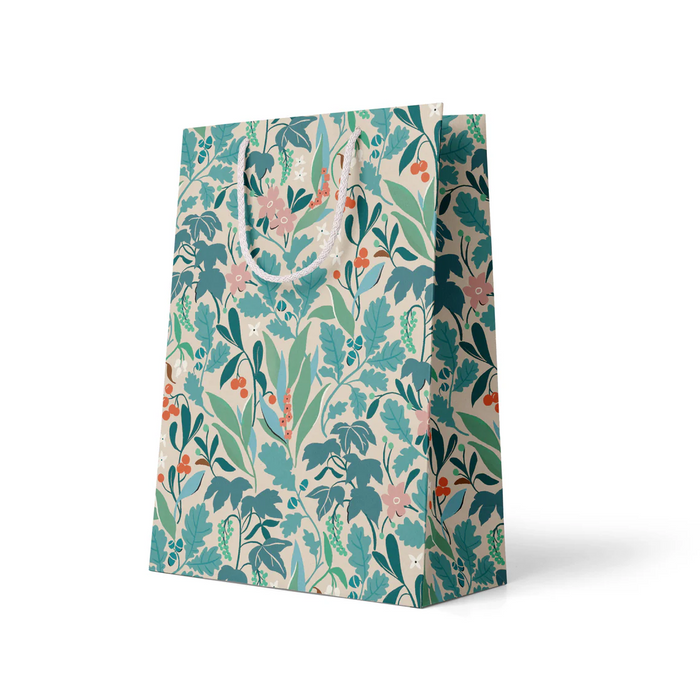 green floral gift bag with white handle