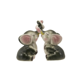 Pair of ceramic mouse figurines holding hands on a white background