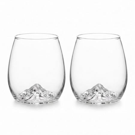 Two clear stemless wine glasses with a sculpted mountain design at the base, shown side by side on a white background.