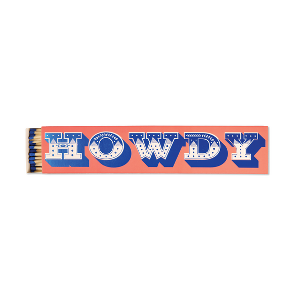 A long rectangular orange matchbox with the word "HOWDY" printed across it in large blue letters with white stars and dots. The box is shown horizontally on a plain white background, with several matches tucked into the left end.