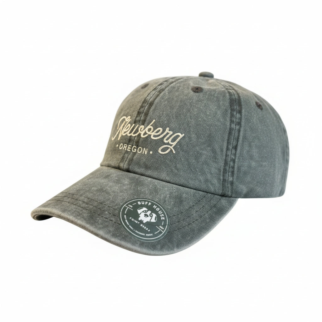 Green hat with Newberg Oregon embroidered on it