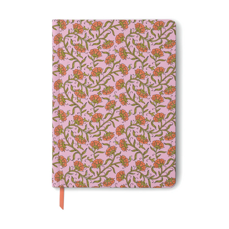 Notebook with floral pattern on a pink background